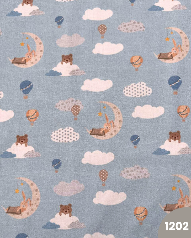 COTONE 100% - 1202 LUNA E MONGOLFIERA FONDO CELESTE