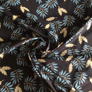 POPELINE DI COTONE FANTASIA - 069 FOGLIE BLUETTE FONDO NERO