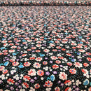 POPELINE DI COTONE FANTASIA - 087 FIORELLINO ARANCIO FONDO NERO A POIS